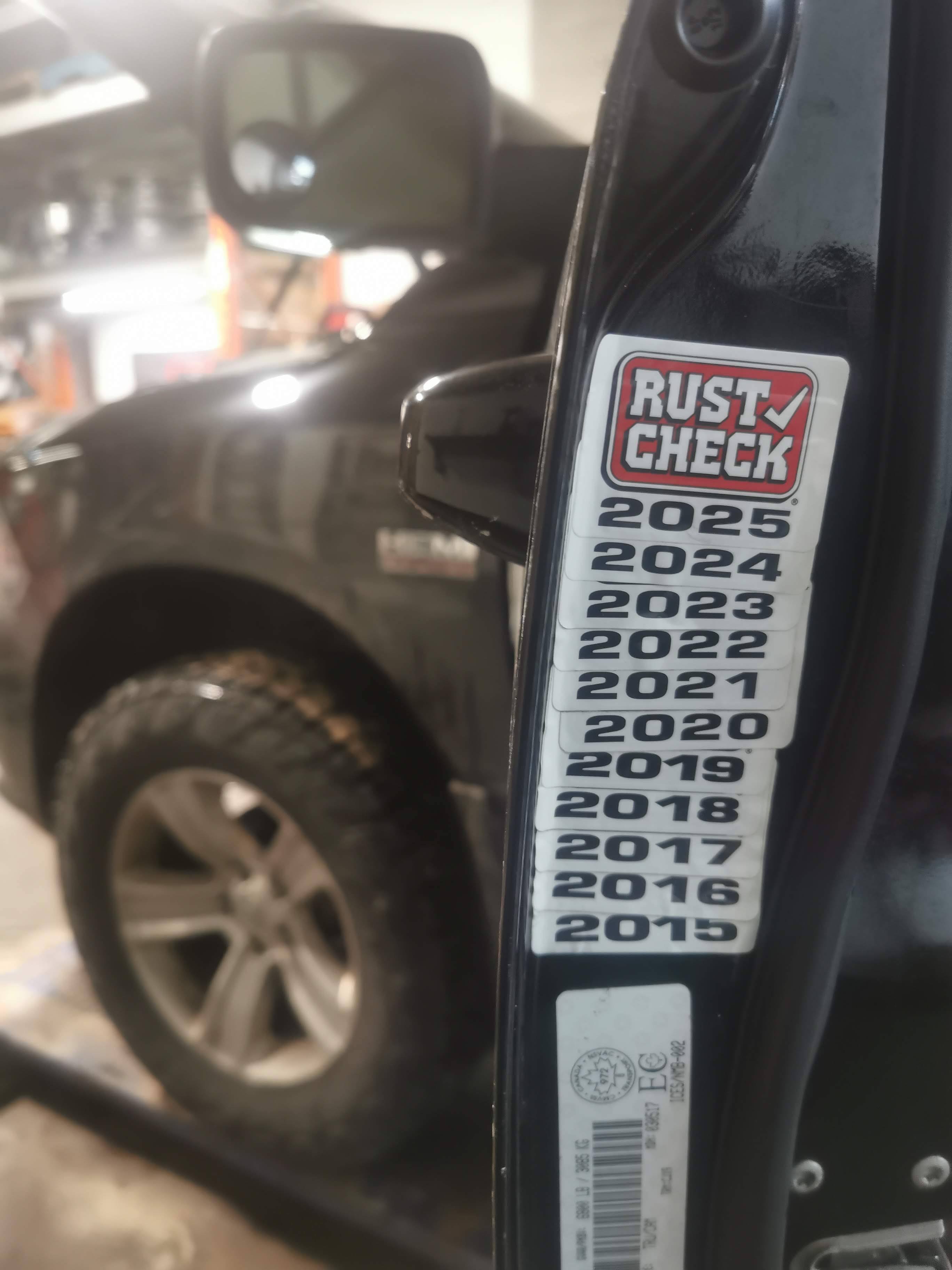 Rust Check service sticker showing years of annual rust protection applications