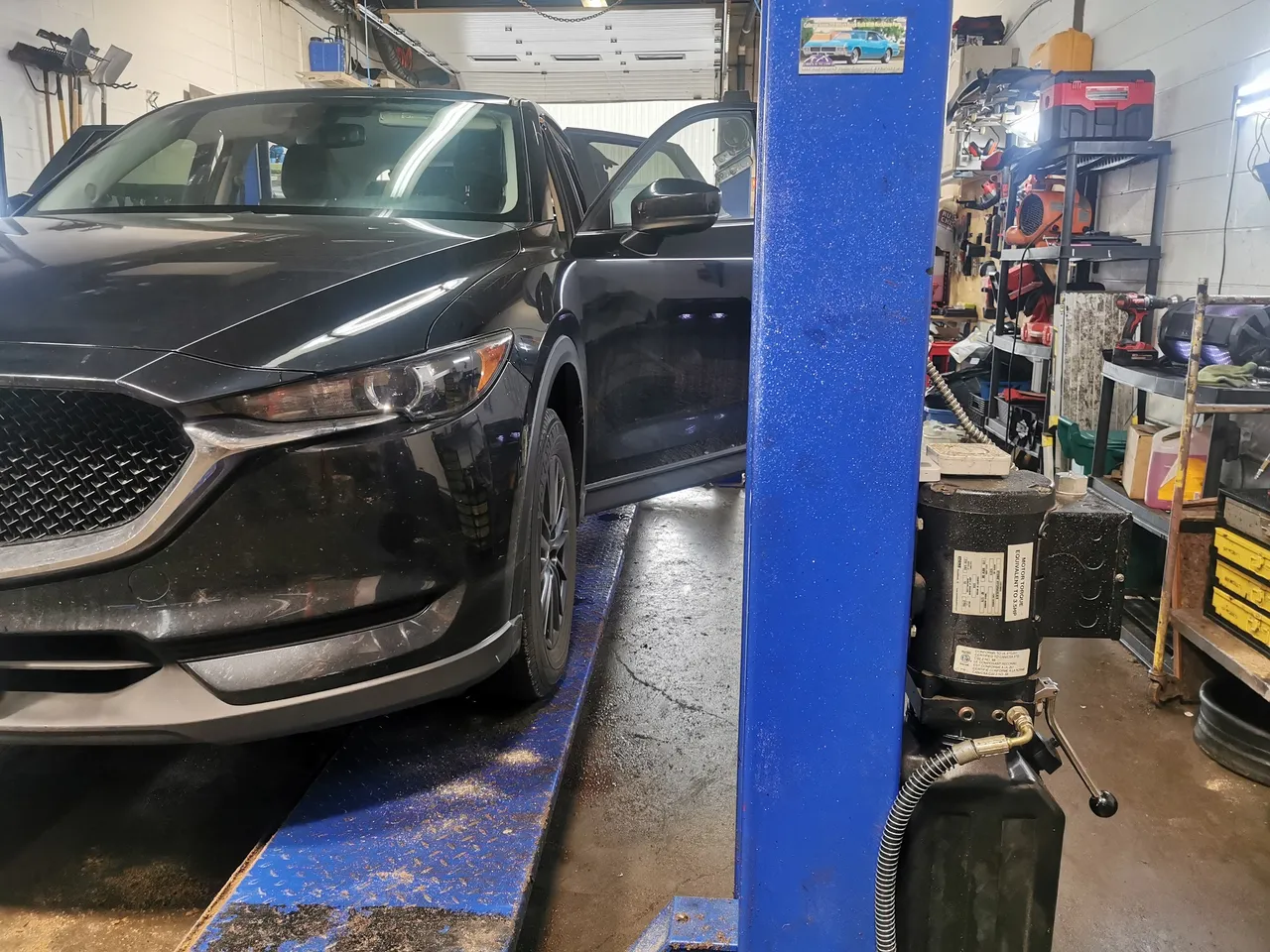 Hyundai Tucson hybrid on hoist for rust check at Ultimate Detail Bowmanville